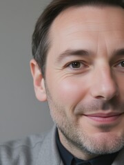 Obraz premium Smiling man portrait indoor studio photography neutral background close-up personal connection