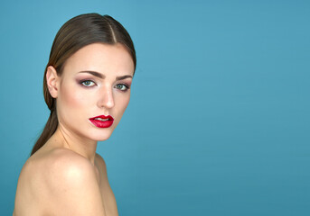 A woman with red lips and green eyes is depicted on a blue background, dressed in translucent...