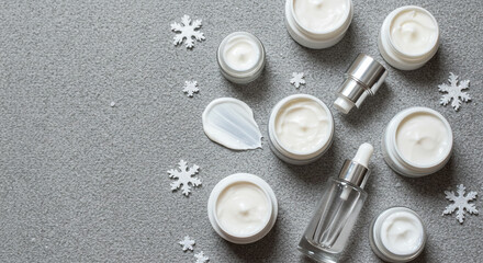 Luxurious winter skincare collection featuring creams and serums with delicate snowflake accents