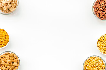 Cereals and flakes from corn and oat on white background top view mockup