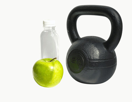 Black 2kg Kettlebell with Fresh Green Apple and Water Bottle on transparent background PNG 