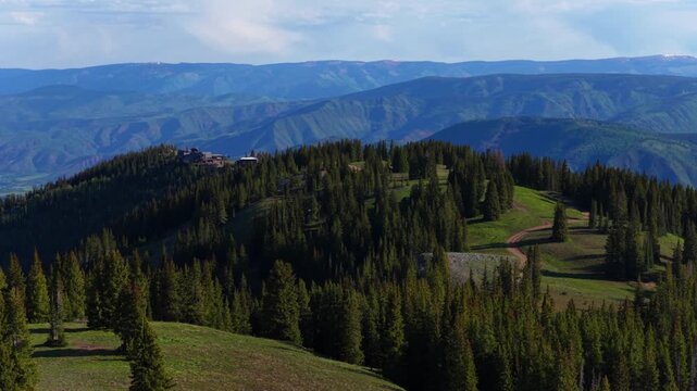 Aspen Gondola Little Annie Basin Trailhead AJAX top of Aspen Mountain aerial drone melting snow Rocky Mountains spring summer morning sunny blue sky Silver Bell Trailhead Richmond Hill circle right
