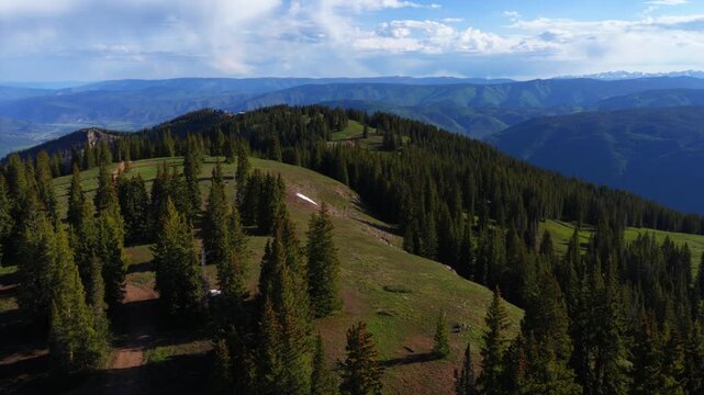 Spring summertime morning Little Annie Basin Trailhead AJAX top of Aspen Mountain aerial drone Independence Pass snow covered Rocky Mountains sunny blue sky Silver Bell Trailhead Richmond Hill forward