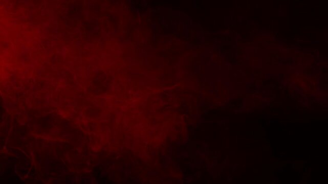Red mist and blood swirls and flows slowly on a black background. Ideal overlay for bloody horror films, dramatic intros, atmosphere of danger or passion