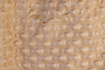 corrugated paper made of waste paper for transporting equipment and objects, paper details with a raised surface and a large number of irregularities