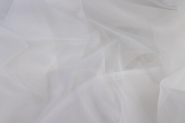 fabric for making white curtains close up, finely woven synthetic threads for making tulle for windows in the home