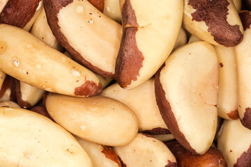 Heap of shelled brazil nuts, top view close-up