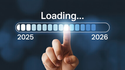 Progress and transition from 2025 to 2026 concept. A person pointing to loading bar transitioning from 2025 to 2026, progress, future planning, and new year goals. annual planning and business growth.