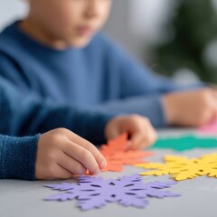 Obraz premium Children cutting colorful paper snowflakes with scissors for Christmas holiday decorations, authentic happiness and creative winter crafting, handmade tradition concept.