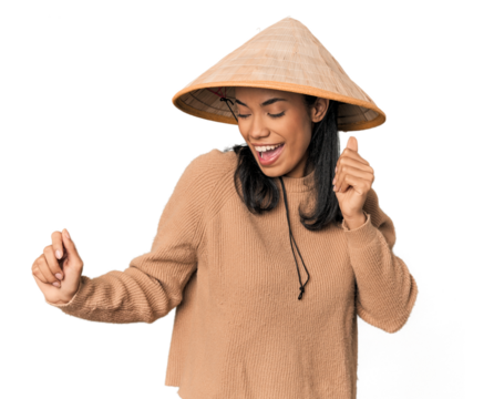 Young Filipina with Vietnamese hat dancing and having fun.