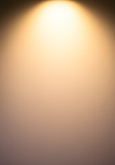 Soft Spotlight Background with Gradient Colors Abstract Warm Lighting Effect for Design and Presentation.