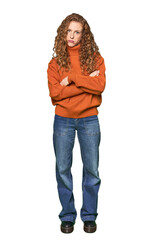 Obraz premium Full-body redhead portrait unhappy looking in camera with sarcastic expression.