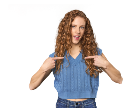 Simple redhead studio portrait surprised pointing with finger, smiling broadly.