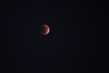 Blood Red Moon in totality during a lunar eclipse. A lunar eclipse is an astronomical event that occurs when the Moon moves into the Earth's shadow