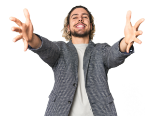 Young businessman in casual blazer feels confident giving a hug to the camera.