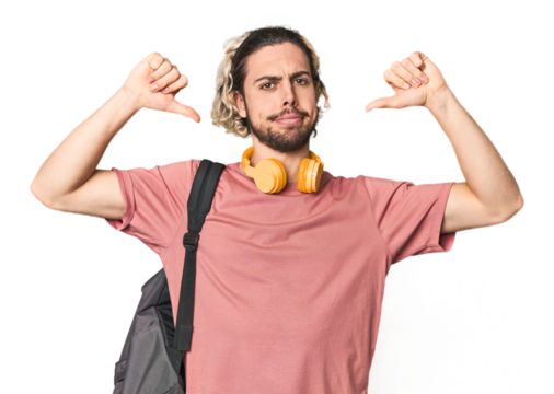 Young student with backpack and headphones feels proud and self confident, example to follow.