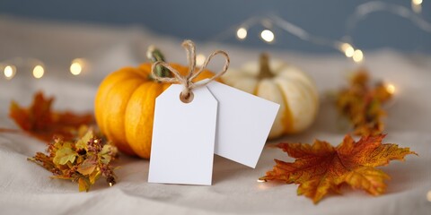 Happy Thanksgiving text with pumpkins and leaves over dark wood background