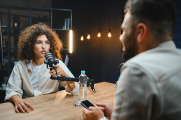 Content creators recording podcast in professional studio