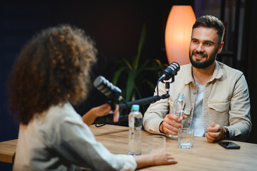Content creators recording podcast in professional studio