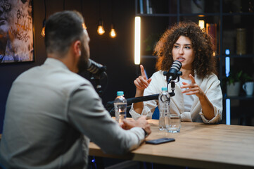 Content creators recording podcast in professional studio