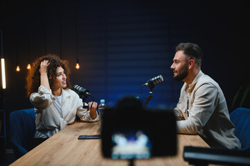 Content creators recording podcast in professional studio