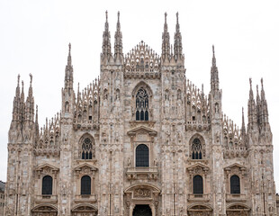 Daytime view of famous Milan Cathedral or Duomo di Milano on piazza in Milan, Italy