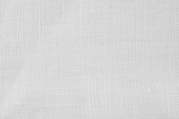 Background from natural white linen fabric. Full depth of field.
