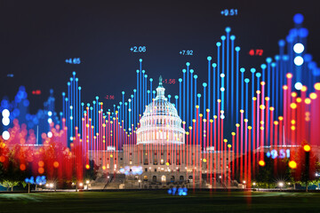 The U. S. Capitol building at night with a holographic overlay of financial data. Double exposure