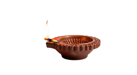 Earthen diya lamp glowing isolated on transparent background, a traditional oil lamp used in india and nepal, especially during diwali and tihar festivals