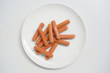 Fresh Sausages Placed on White Dish.