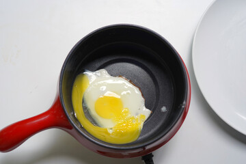 Fried omelet in a frying pan. closeup image