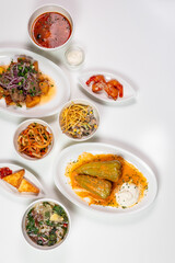 With copy space. Lunch of various dishes on a white background with copy space