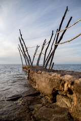 traditional wooden "grue" in Savudrija, Istria. These unique cranes lift fishing boats to protect them from the rocky coastline and winds.