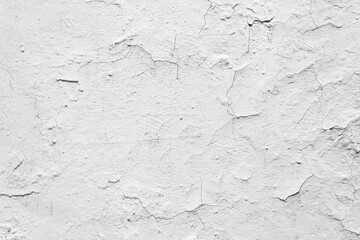 Old white grunge wall with cracked paint. High resolution vintage background.