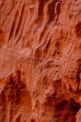 Winding sandstone walls and red textures in Antelope Canyon