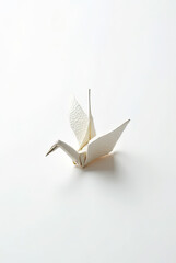 A single origami crane folded from textured paper, representing peace, mindfulness, and Japanese tradition.