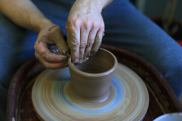 Crafting Clay: Hands at the Pottery Wheel