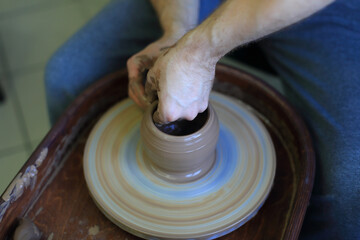 Crafting Clay: Hands at the Pottery Wheel