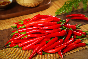 Fresh Red Hot Chili Peppers on Bamboo Cutting Board Kitchen Cooking Ingredients