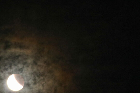 A beautiful rare blood moon on a dark night sky