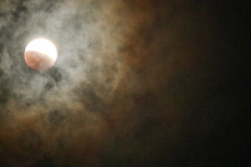 A beautiful rare blood moon on a dark night sky