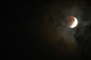 A beautiful rare blood moon on a dark night sky