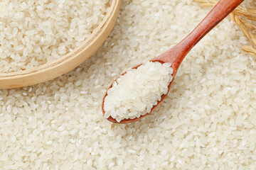 Fresh White Pearl Rice Grains in Wooden Bowl and Spoon Display