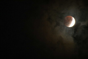 A beautiful rare blood moon on a dark night sky