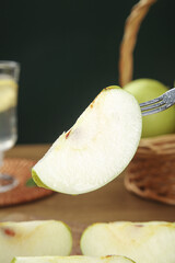 Fresh Green Pear Slice on Fork - Healthy Fruit Snack Close-up