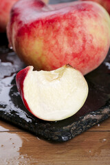 Fresh Shaanxi Province Peaches with Creamy White Flesh and Red Skin on Slate Board