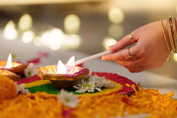 Lighting Diwali Candle with a Stick