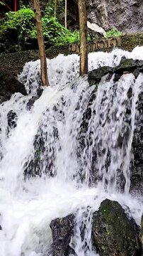 Cool, clear waterfall in the middle of the forest