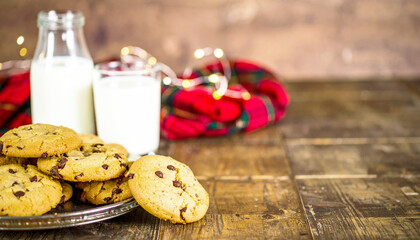 Homemade chocolate chip cookies on a rustic wooden table. AI