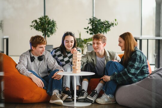 Friends playing engaging board game, having fun together